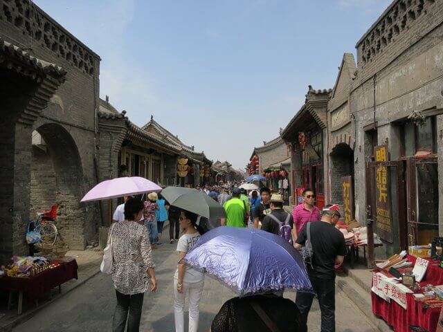Chinese Tourists with Umbrellas