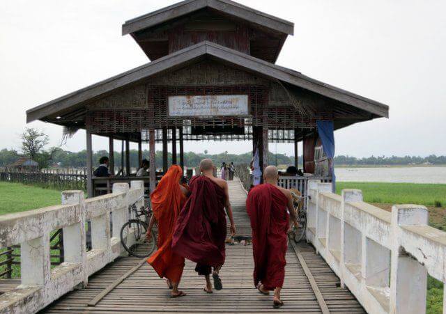 Monks crossing U Bein's bridge