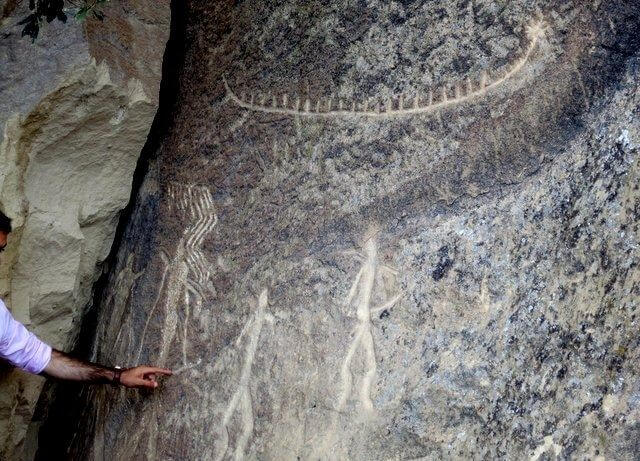 Stick figure rock carvings at Gobustan