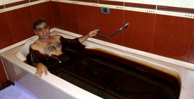 Man in an oil bath
