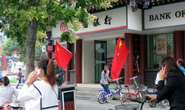 Chinese flags outside a bank
