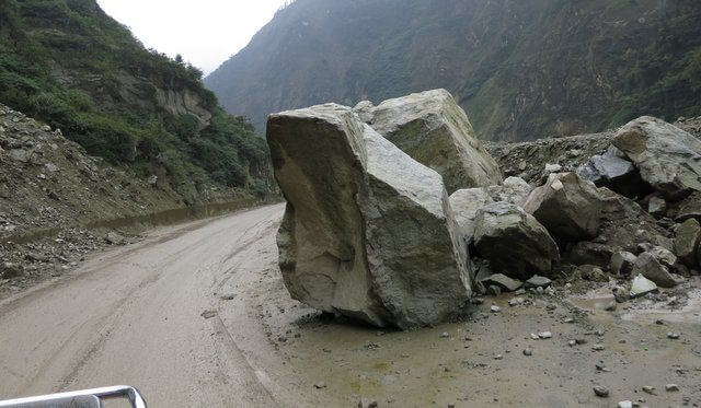 Rock blocking the road in Sichuan