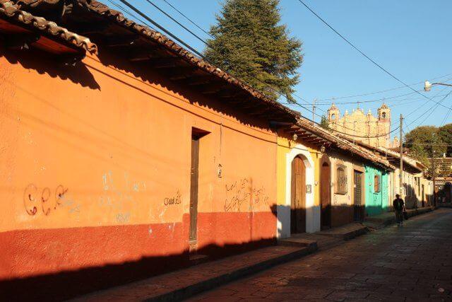 Brightly coloured streets with Santo Domingo in the background