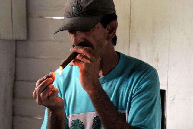 Lighting a cuban cigar
