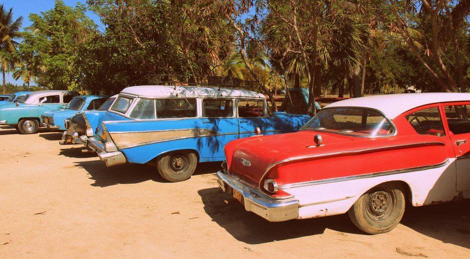 Classic cars at the beach in Trinidad, Cuba