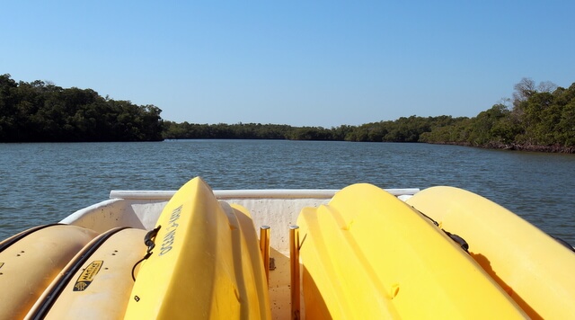 Kayaks waiting on the front of the boat